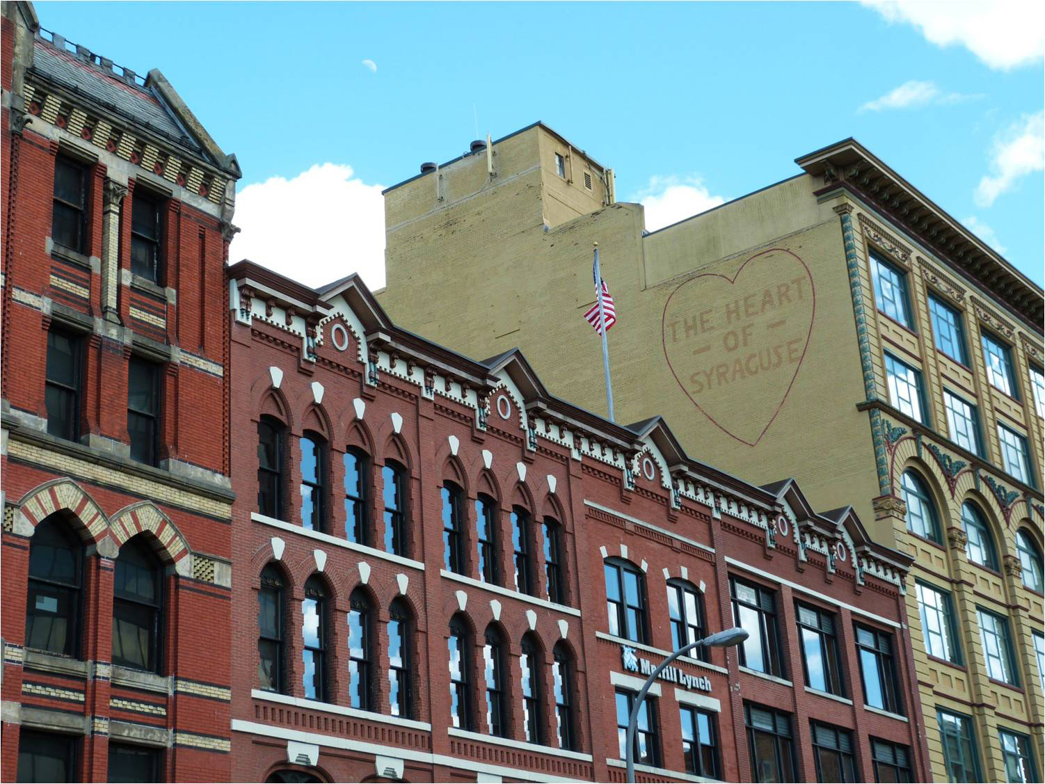 Mural on brick building reads "The Heart of Syracuse"